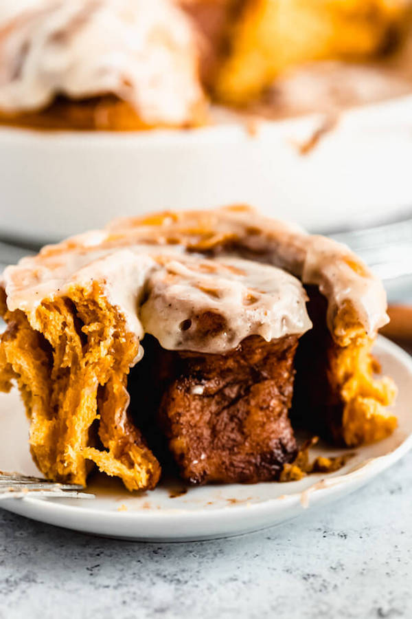 pumpkin cinnamon rolls topped with browned butter cream cheese icing