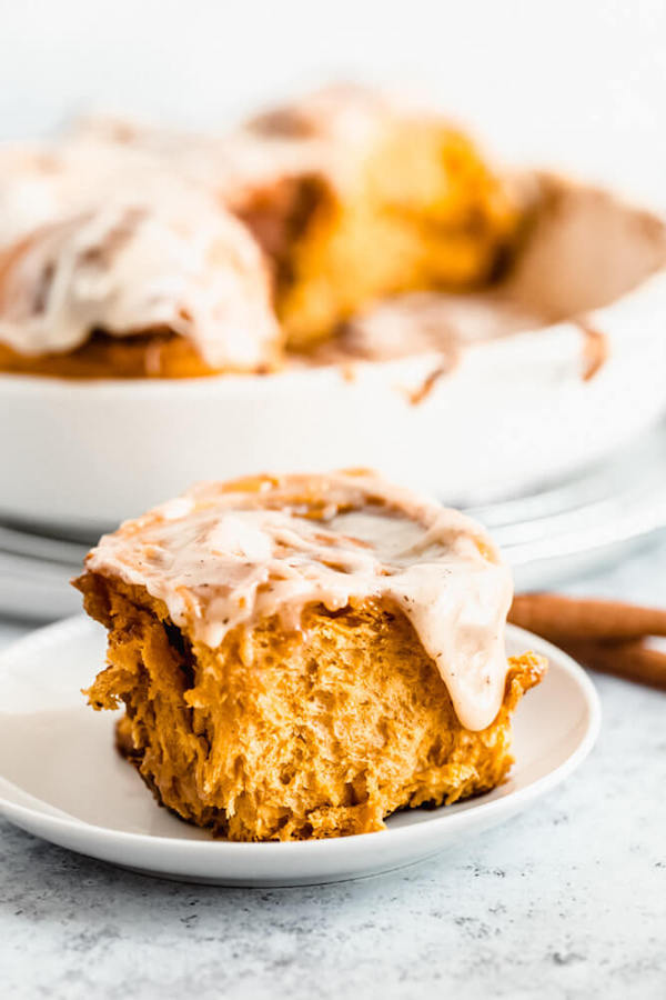 pumpkin cinnamon rolls topped with browned butter cream cheese icing