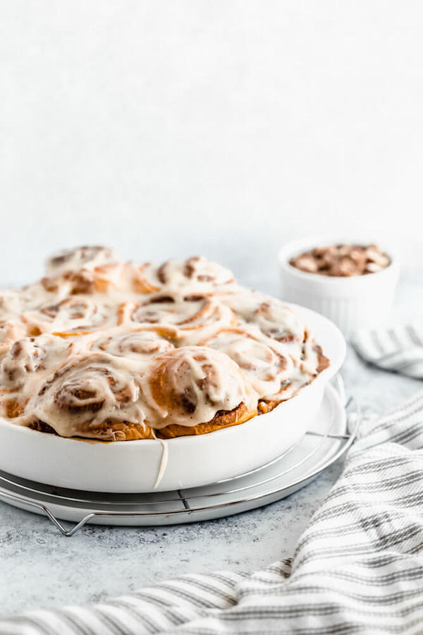 pumpkin cinnamon rolls topped with browned butter cream cheese icing