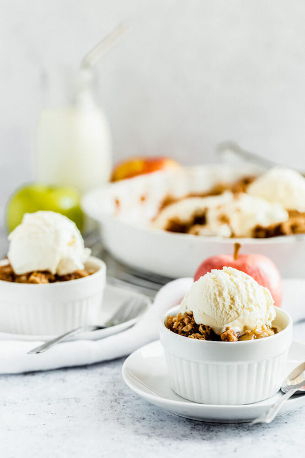 apple crisp topped with vanilla ice cream 