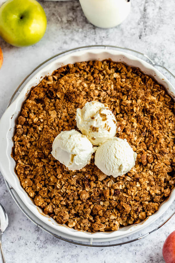 apple crisp topped with vanilla ice cream 