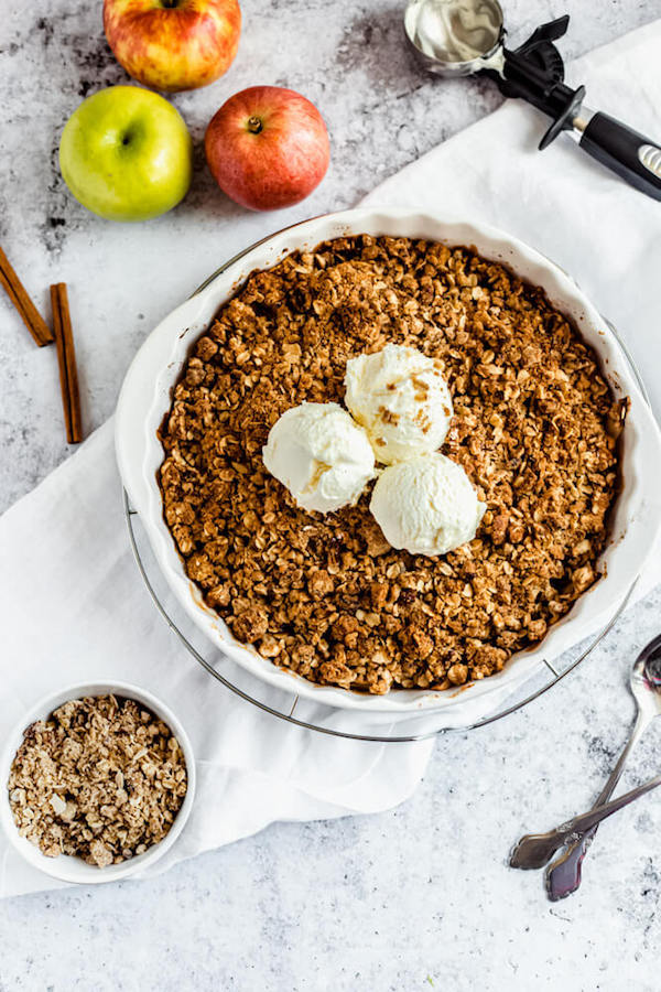 apple crisp topped with vanilla ice cream 