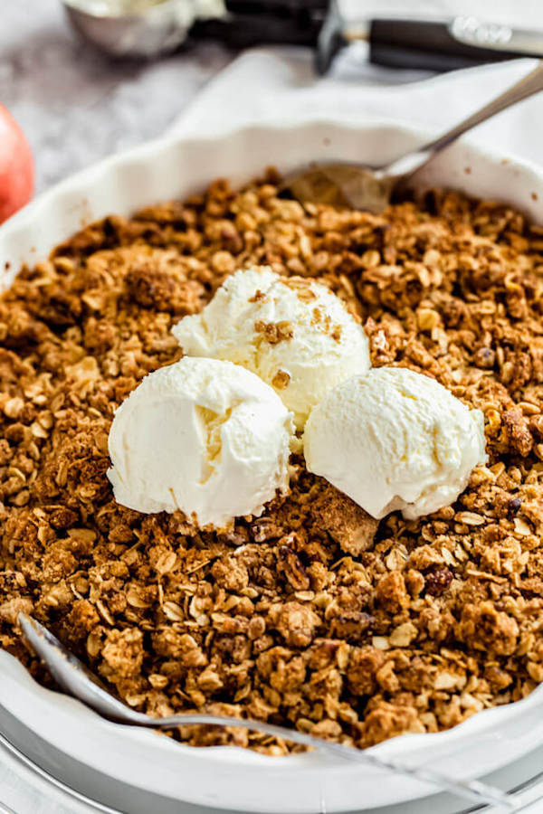 apple crisp topped with vanilla ice cream 