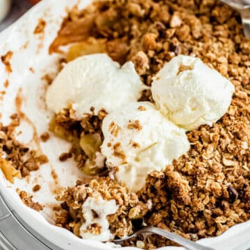 apple crisp topped with vanilla ice cream