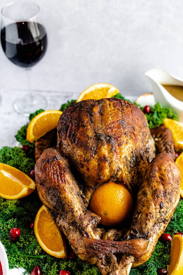 roasted turkey on a decorative turkey platter