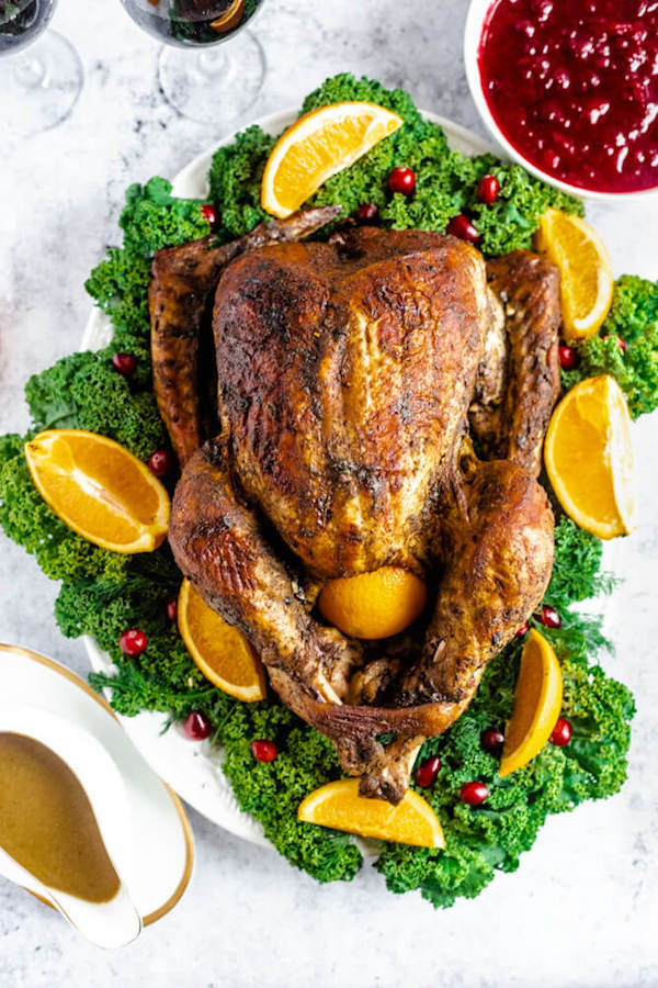 roasted turkey on a decorative turkey platter