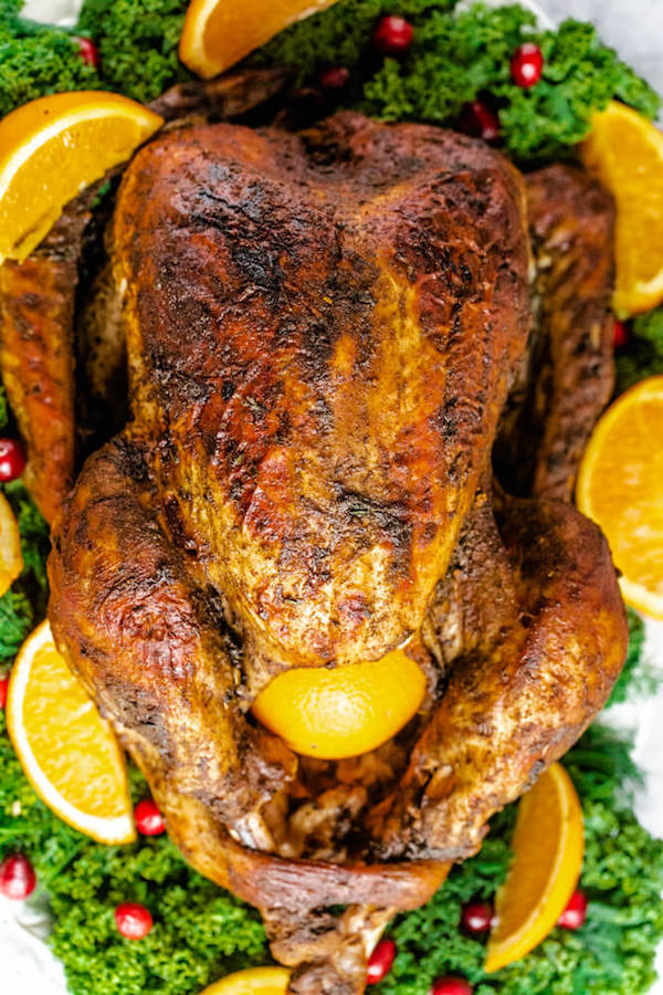 roasted turkey on a decorative turkey platter