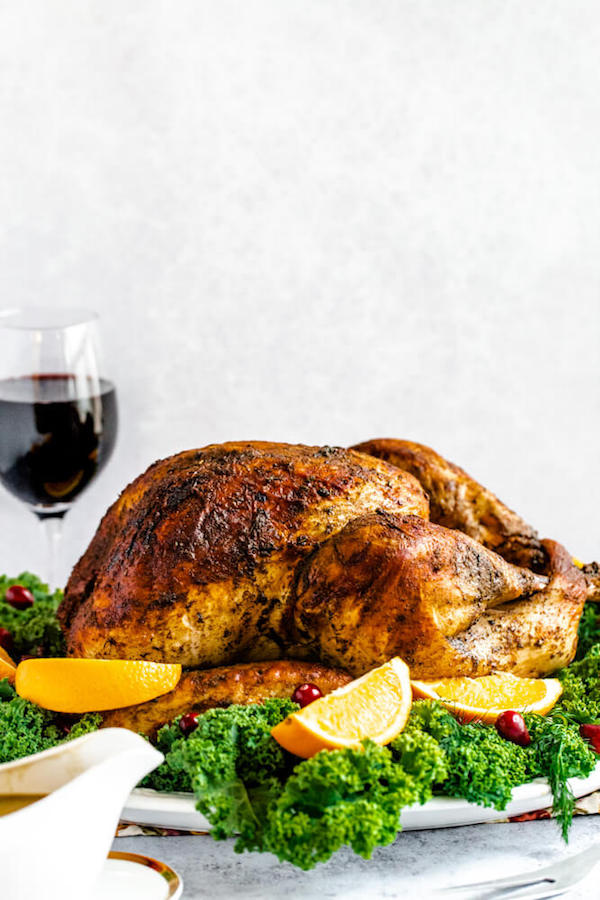 roasted turkey on a decorative turkey platter