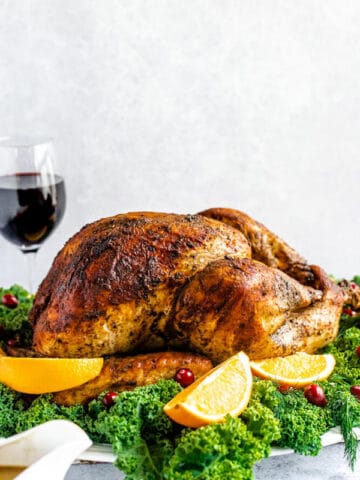 roasted turkey on a decorative turkey platter