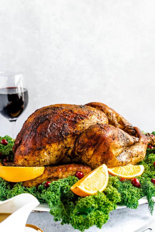 roasted turkey on a decorative turkey platter