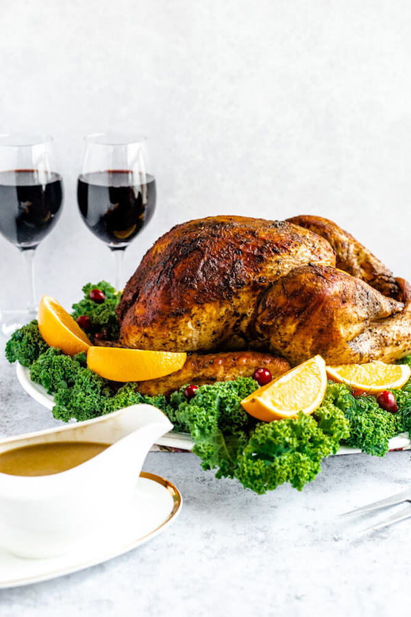 roasted turkey on a decorative turkey platter