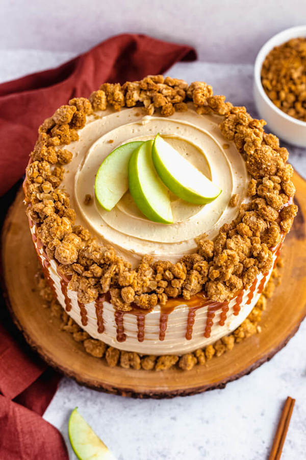 top view of apple crumble cake with crumble around the edges and apple slices in the centre 