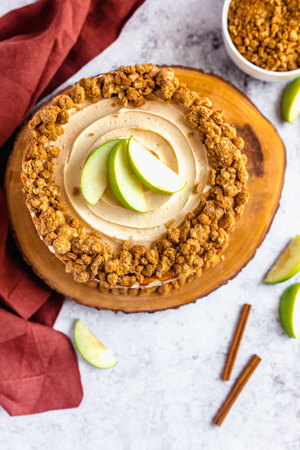 top view of apple crumble cake with crumble around the edges and apple slices in the centre 