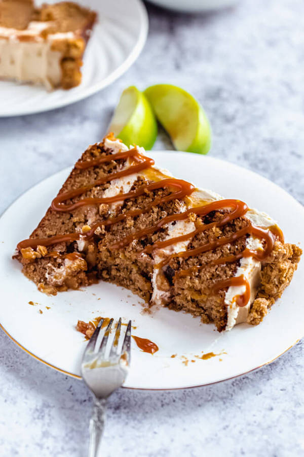 half eaten slice of caramel apple crumble cake on a plate