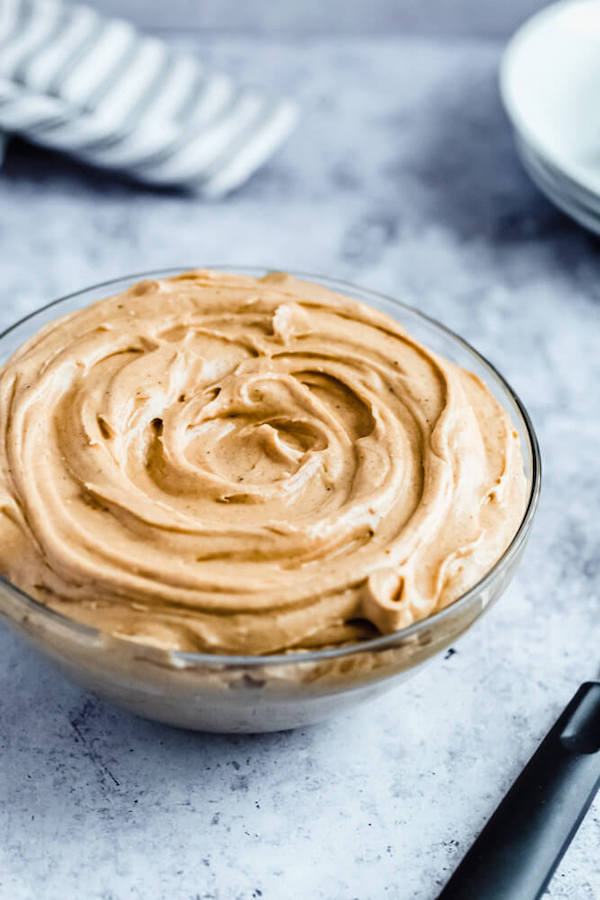 caramel pumpkin spice cream cheese frosting in a bowl