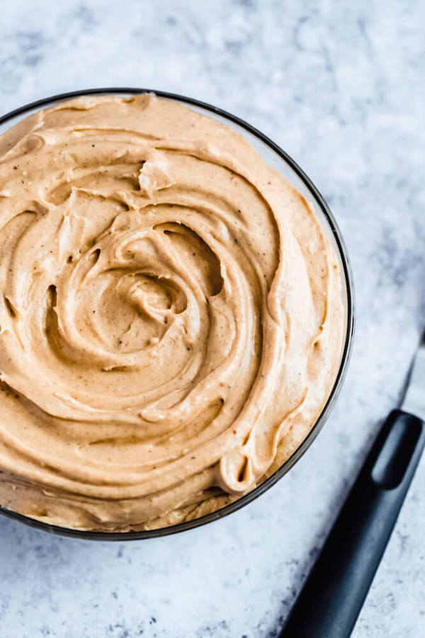 caramel pumpkin spice cream cheese frosting in a bowl