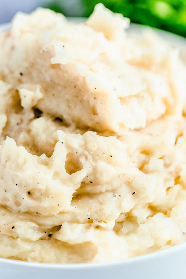 a bowl of mashed potatoes close up