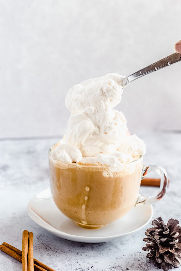 homemade pumpkin spice latte topped with whipped cream 