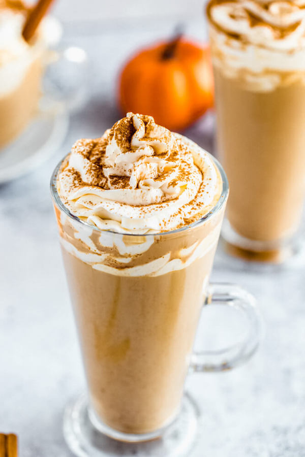 homemade pumpkin spice latte topped with whipped cream and a dust of cinnamon