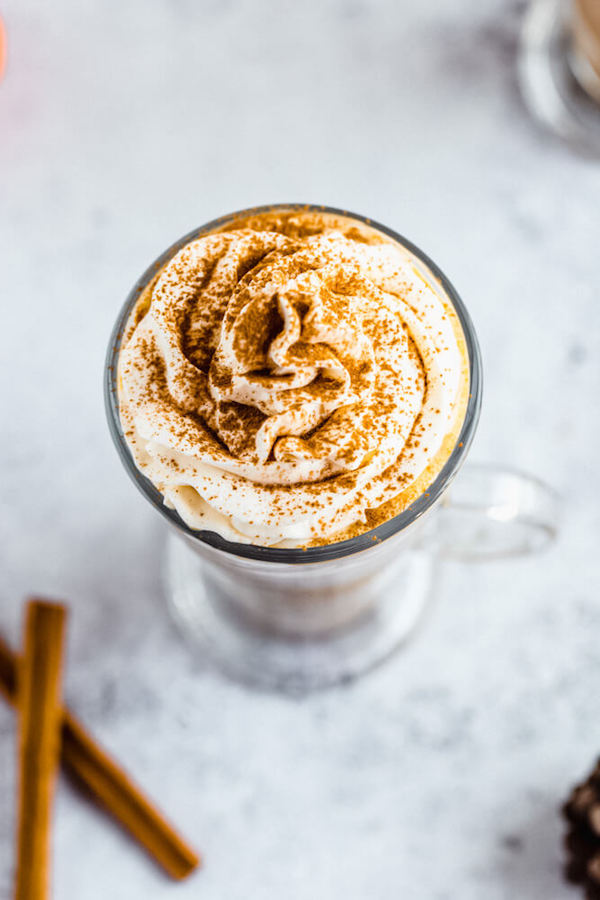 homemade pumpkin spice latte topped with whipped cream and a dust of cinnamon