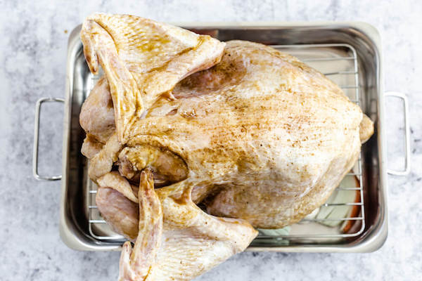 upside down turkey coated in seasoned butter