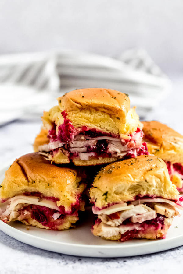 stack of turkey cranberry sliders on a plate