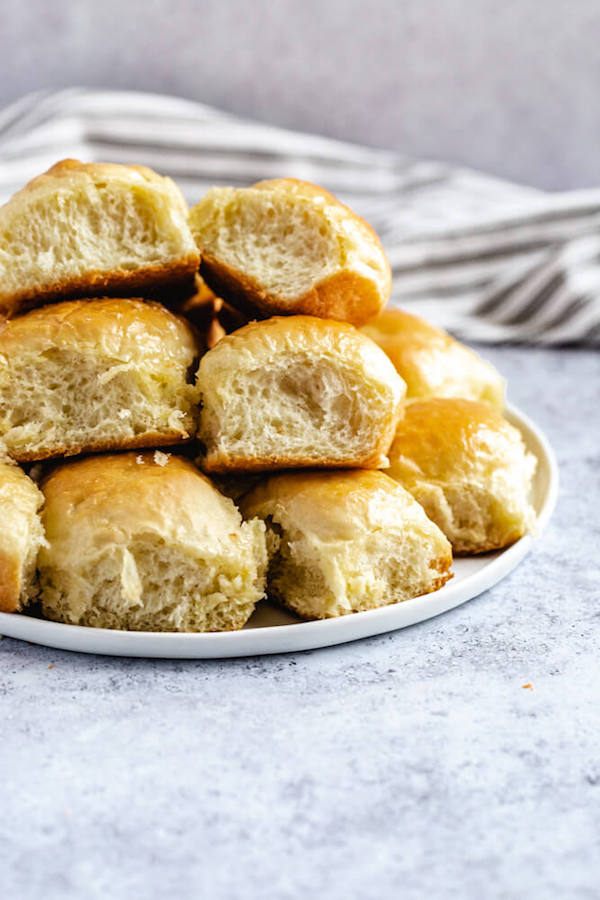 dinner rolls stacked on a plate