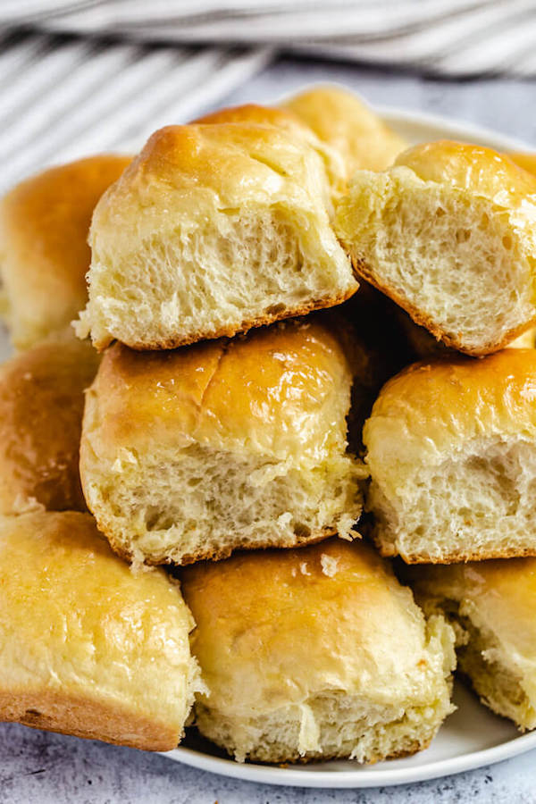 dinner rolls stacked on a plate