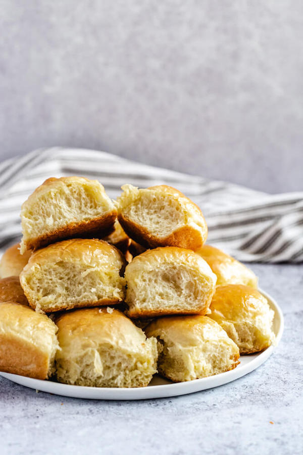 dinner rolls stacked on a plate