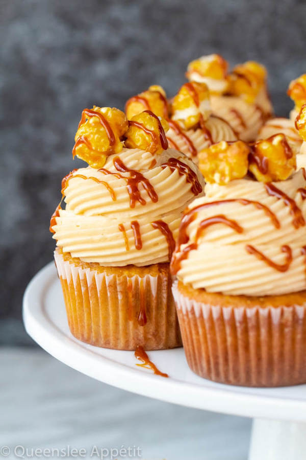 caramel popcorn flavoured cupcakes on a white cake stand