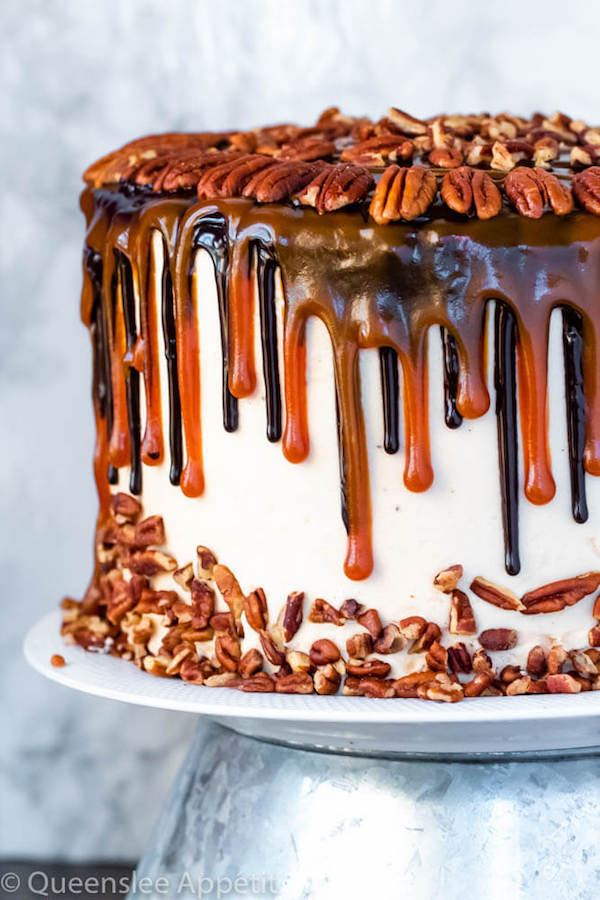 caramel pecan cake on a white plate