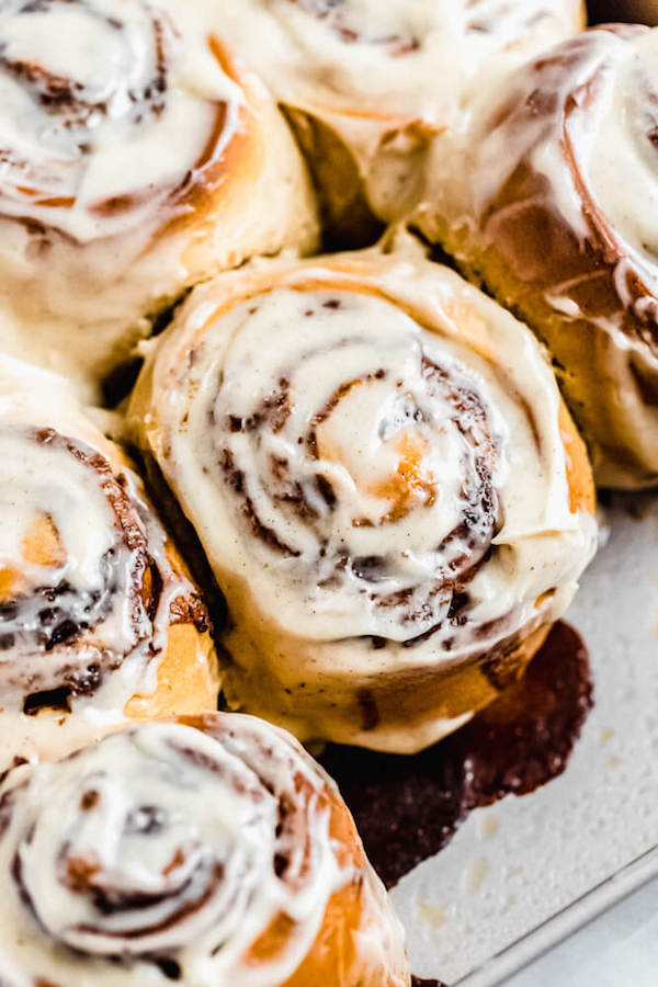 close up of chai cinnamon rolls in a square pan