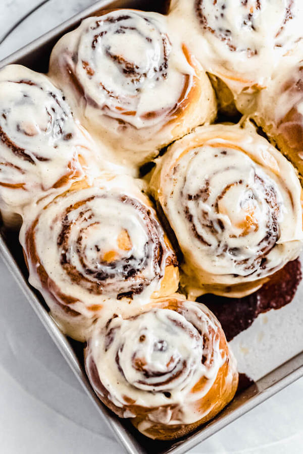 chai latte cinnamon rolls in a square cake pan