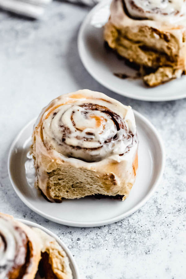 chai latte cinnamon roll on an appetizer plate