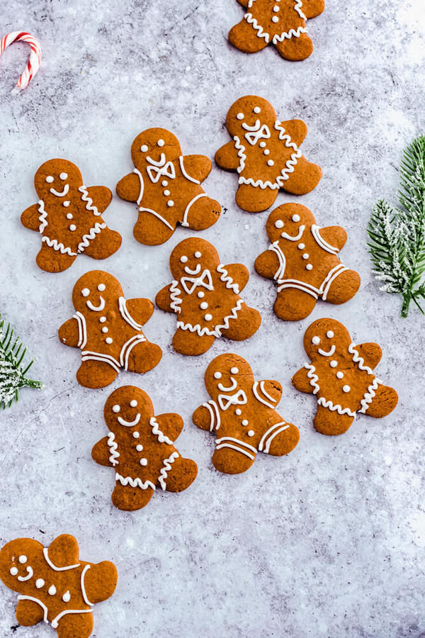 top angled shot of 3 rows of decorated gingerbread Christmas cookies