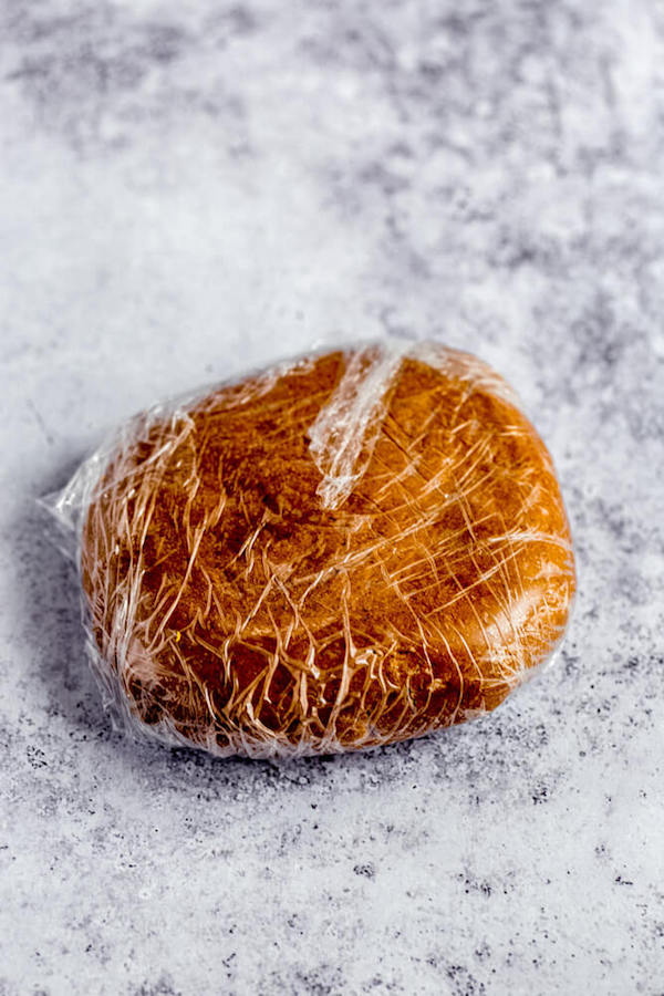 wrapped disk of gingerbread cookie dough