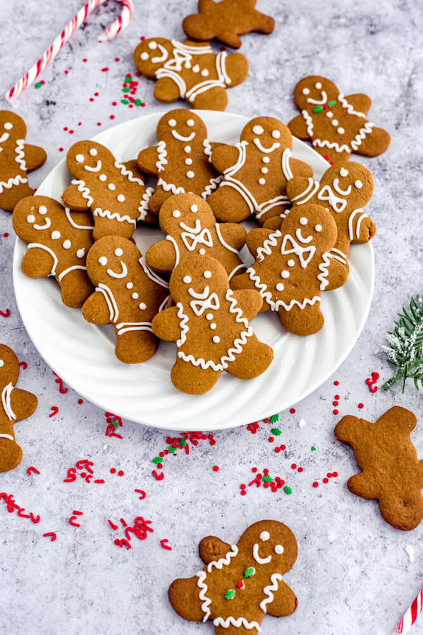 side view of decorated Christmas cookies on a white plate