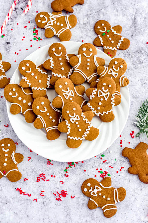 close up of gingerbread Christmas cookies on a white plate