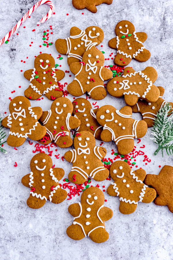 cluster of decorated Christmas cookies topped with candy cane sprinkles