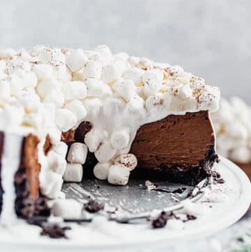 inside of sliced chocolate cheesecake with marshmallows dripping down