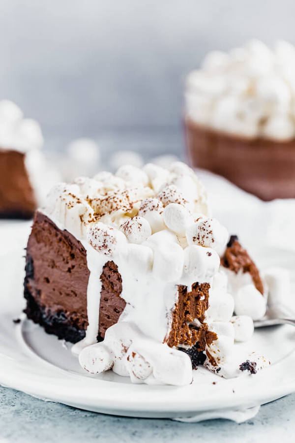 slice of chocolate cheesecake topped with marshmallows