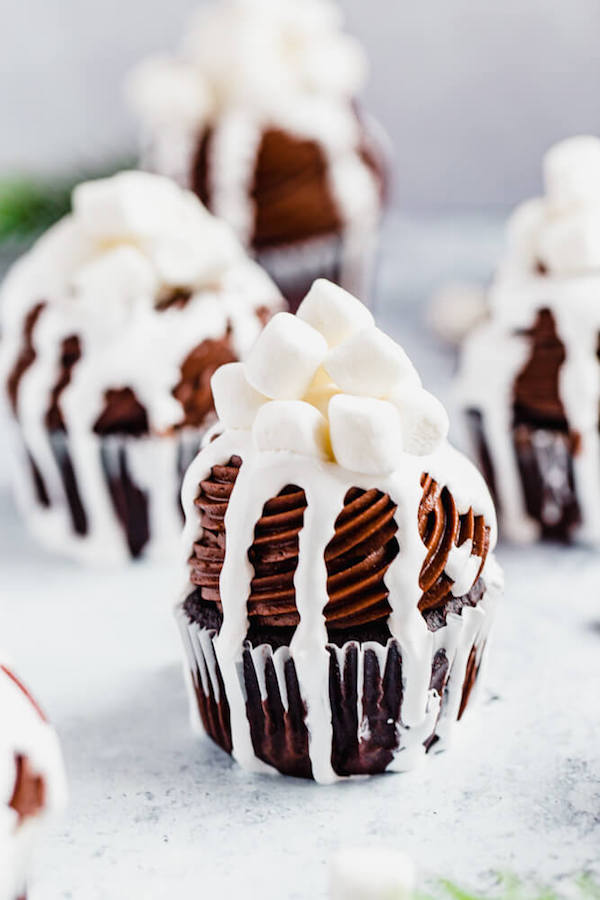 front shot of hot chocolate cupcakes with marshmallow drip 