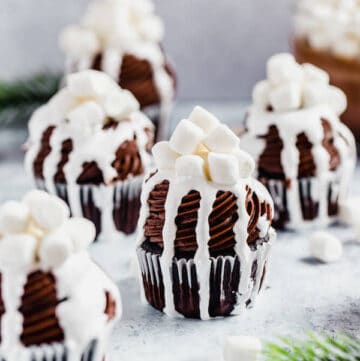 hot chocolate cupcakes with hot chocolate in the background