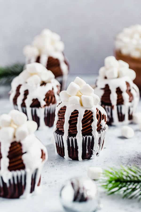 hot chocolate cupcakes with hot chocolate in the background