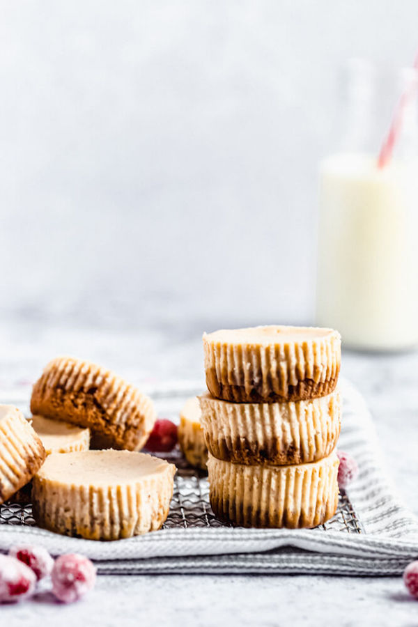 3 undecorated mini cheesecakes stacked on top of each other