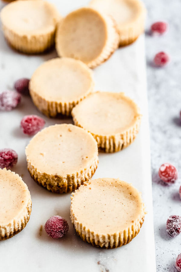 plain mini eggnog cheesecakes on a marble board