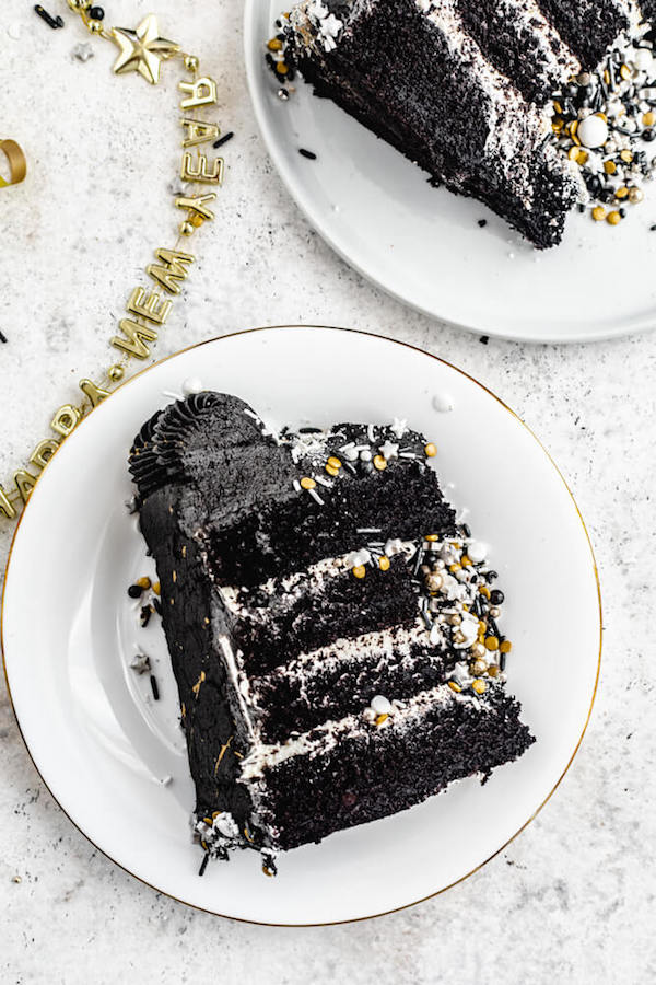 black chocolate cake on a white plate