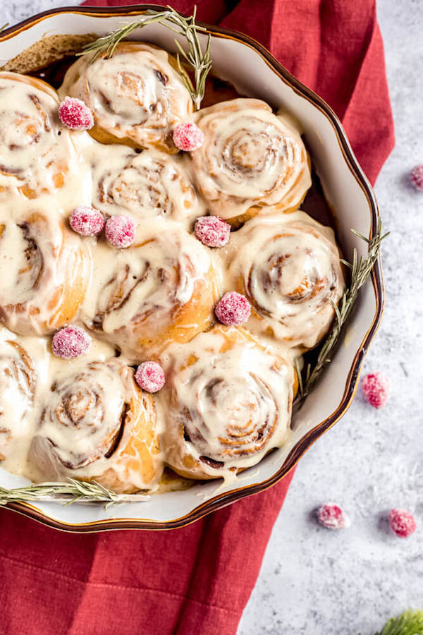 cinnamon rolls topped with sugared cranberries 