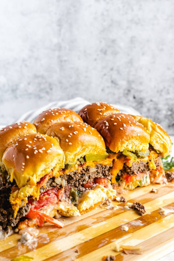 hamburger sliders on a wooden cutting board