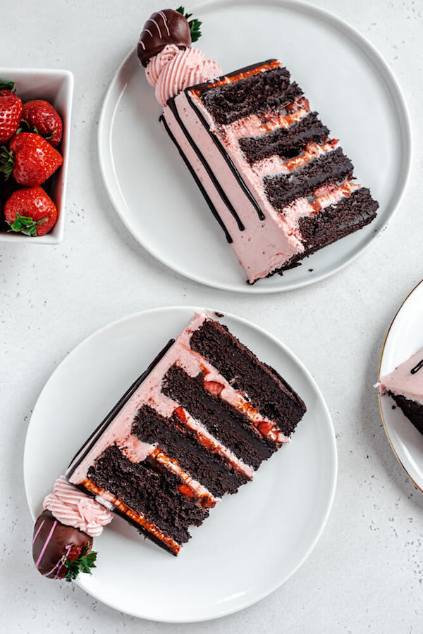 two slices of cake on white plates